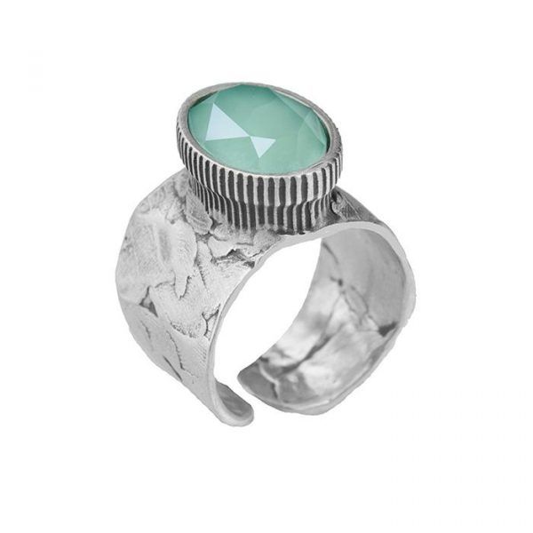 silver ring with wide band and crystal
