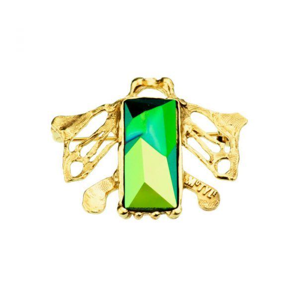 silver brooch with green crystal
