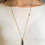 silver artistic necklace with blue crystal