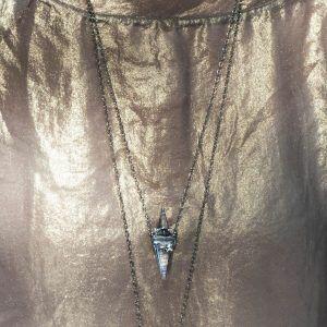 silver necklace beige shirt