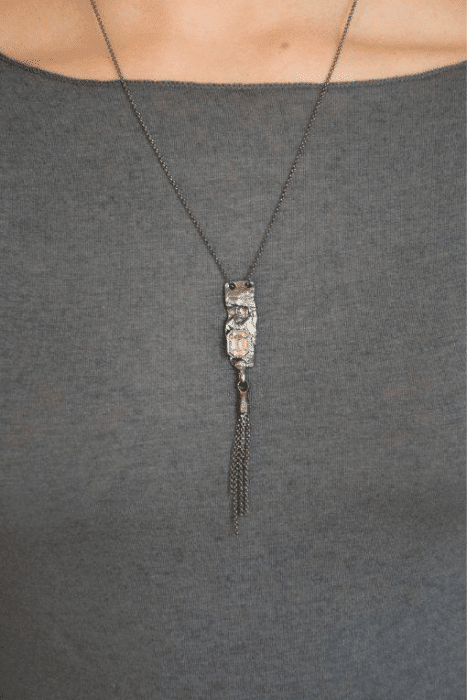 silver unique necklace with bright crystal