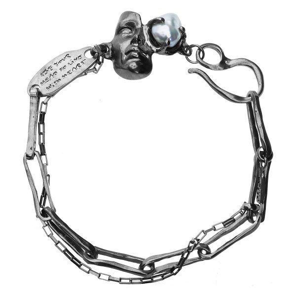 Artistic silver bracelet with natural pearl