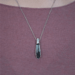 silver artistic necklace with grey crystal