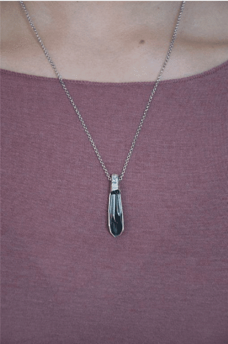silver artistic necklace with grey crystal
