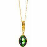 Artisic silver necklace with green crystal