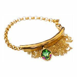 Artistic silver bracelet with green crystal