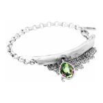 Artistic silver bracelet with green crystal