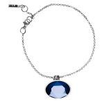 Artistic silver bracelet with blue crystal