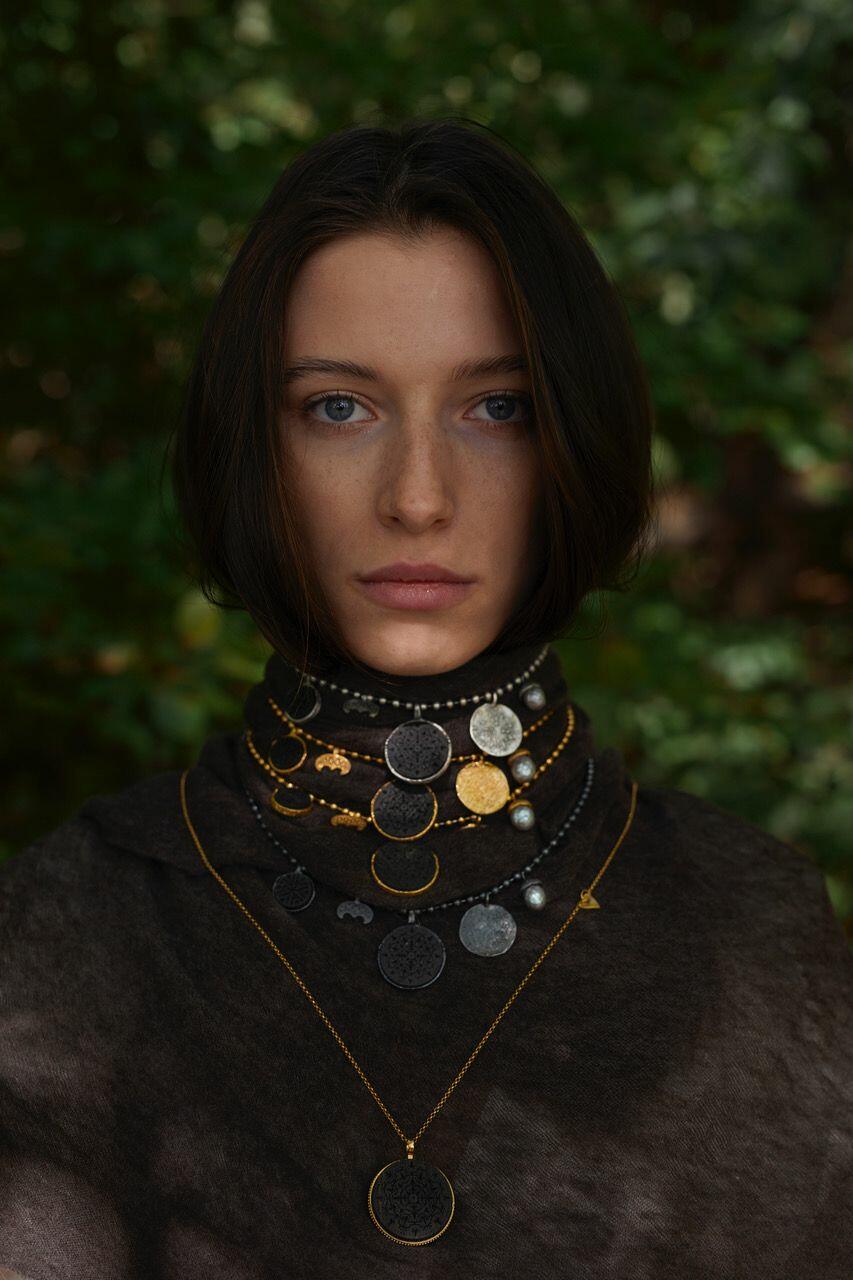 artistic silver necklace with black oak
